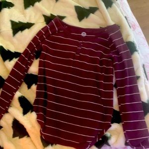 It a white stripped sweater